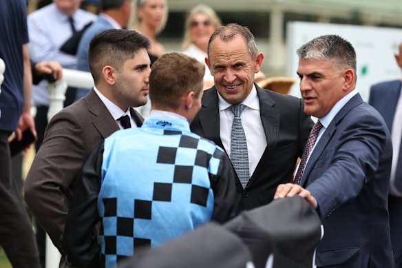 Riccardo Surace jnr and snr, left and right respectively, talk to trainer Chris Waller and jockey James McDonald after Generosity’s Challenge Stakes win last Saturday.
