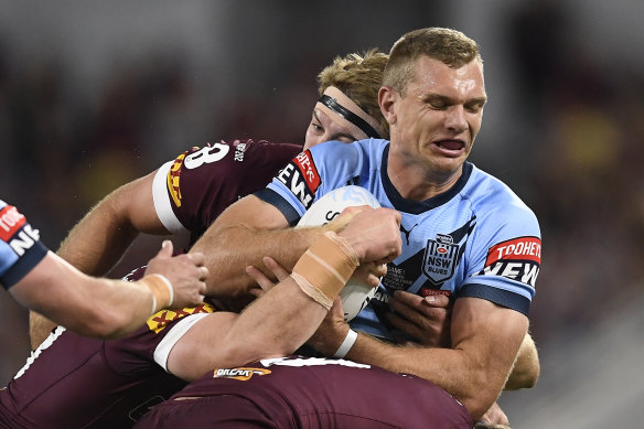 Tom Trbojevic of the Blues is tackled during game one.