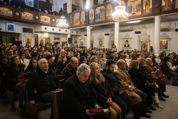Syrians attend a Christmas Eve mass at Our Lady of Damascus Church in the Syrian capital.