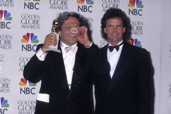 Miller and producer Doug Mitchell in 1996, with their Golden Globe award for Babe. 