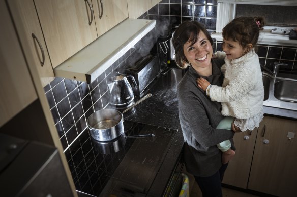 Ingrid Jolley, with daughter Hazel, has converted her home’s gas appliances to electric.
