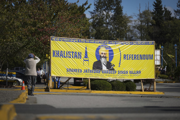 A photograph of late temple president Hardeep Singh Nijjar is seen on a banner outside the Guru Nanak Sikh Gurdwara Sahib in Surrey, British Columbia.