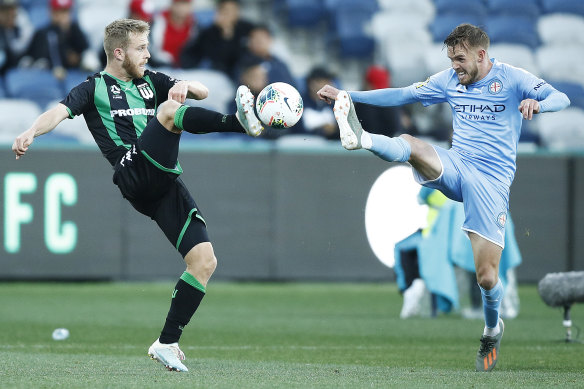 Onwards and upwards: Connor Pain, left, against Melbourne City in round three. 