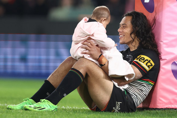 Jarome Luai with daughter Akira after clinching a place in the 2022 grand final.