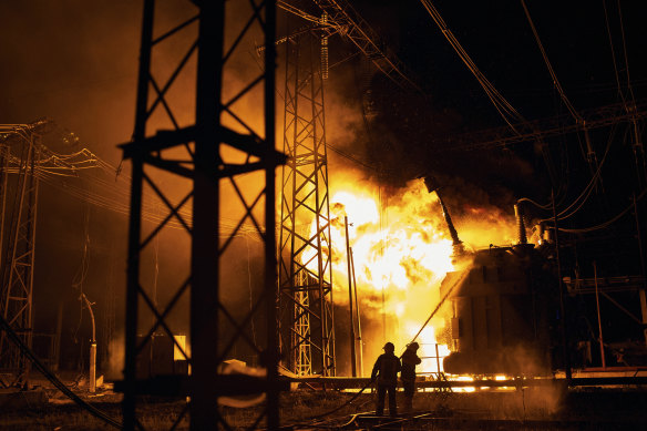 Ukrainian State Emergency Service firefighters put out the fire after a Russian rocket attack hit an electric power station in Kharkiv, Ukraine.