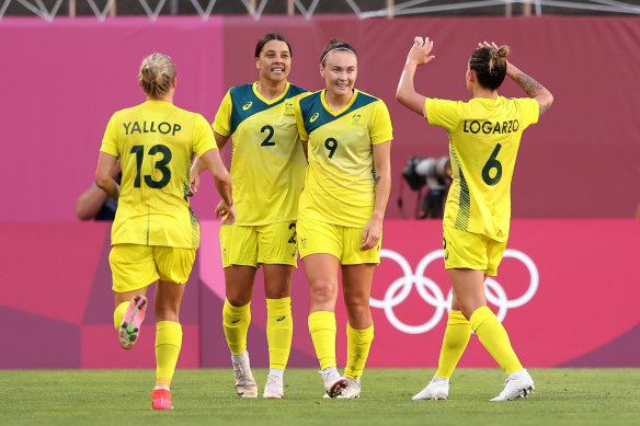 Sam Kerr and Caitlin Foord celebrate after scoring against the US in Tokyo.