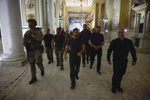 Volodymyr Zelensky (centre) inspects damage of the Odesa Transfiguration Cathedral in Odesa on Thursday, July 27.