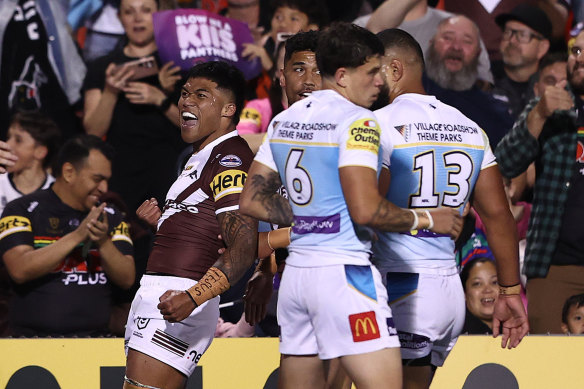 Brian To’o celebrates scoring a try against the Titans.