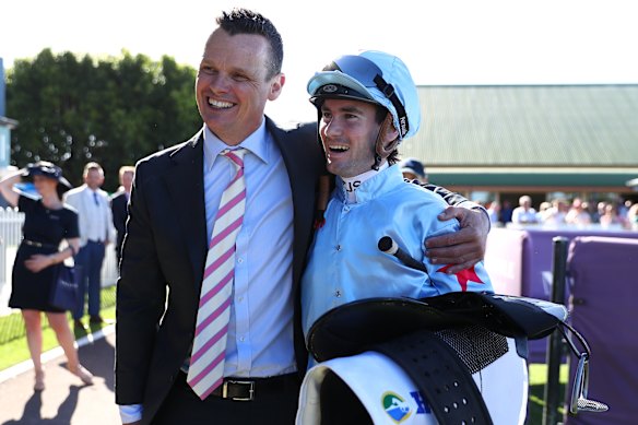 Joe Pride with jockey Tyler Schiller after Coal Crusher’s win.