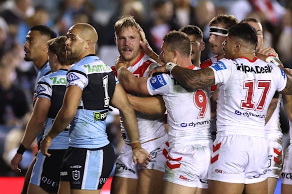 Happy Jack: De Belin celebrates his try.