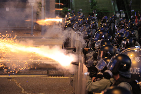 Hong Kong police fire tear gas at protesters in Sai Wan on Sunday night.
