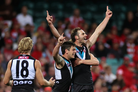Jeremy Finlayson celebrates a goal late against the Swans.