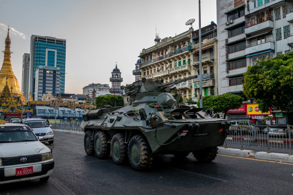 An armoured vehicle moves through Yangon on Sunday.