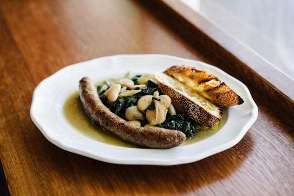 Italian sausage with silverbeets, butter beans and baguette.