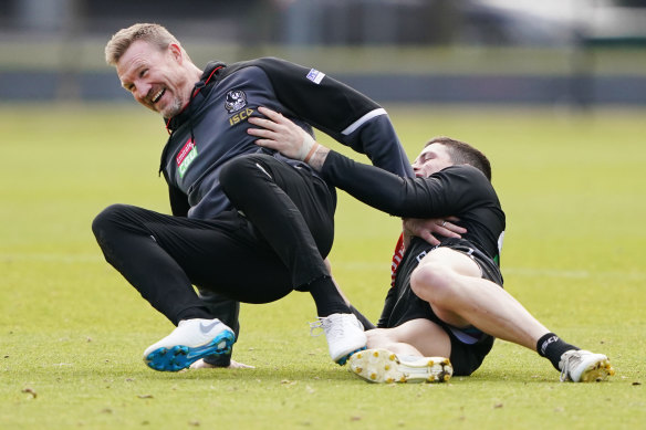 Collingwood coach Nathan Buckley (left) is preparing for Friday night's blockbuster clash with Essendon. 