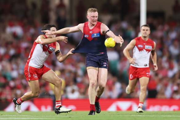 Clayton Oliver kicks the ball during opening round.