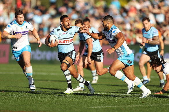 Cronulla’s Sione Katoa makes a break against the Titans in Coffs Harbour.