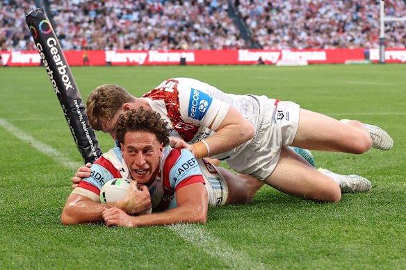 Mark Nawaqanitawase scores a try on Anzac Day against the Dragons. 