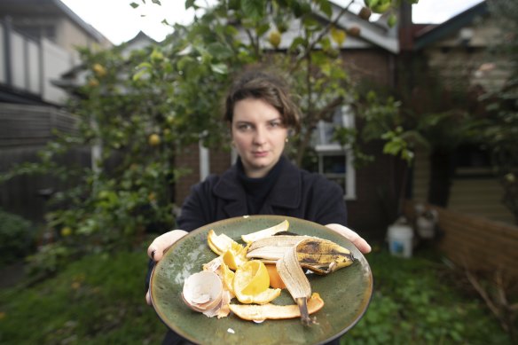 Zoe (Helga) Alsop with food scraps from her housemates outside her Clifton Hill home.