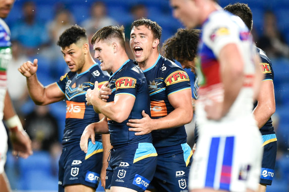 AJ Brimson celebrates with his teammates after scoring a try.