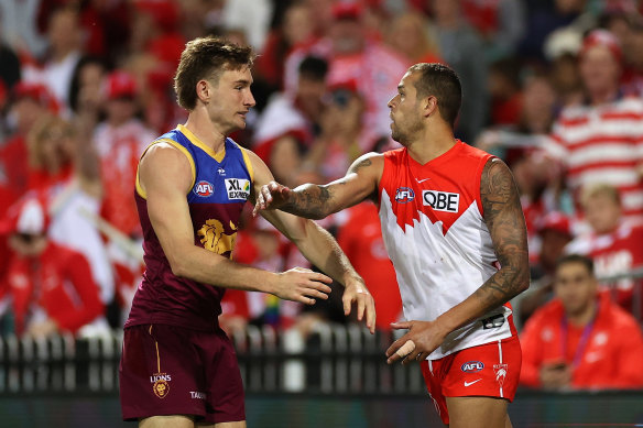 Brisbane’s Harris Andrews exchanges words with Swans star Lance Franklin.