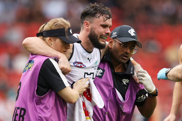 Zac Williams is helped from the field after hurting his Achilles.