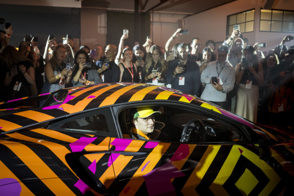 Piastri arrives at a corporate function in a McLaren Artura painted by Melbourne artist Reko Rennie.