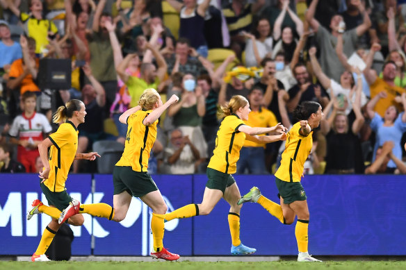 Sam Kerr leads the Matildas’ celebrations after scoring the winning goal in injury time.