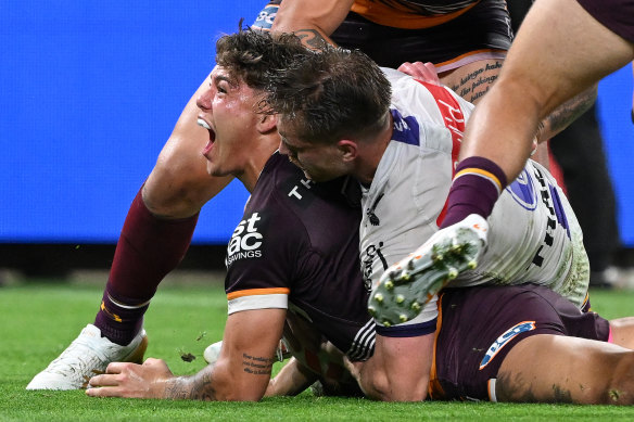 Reece Walsh scores against Melbourne.