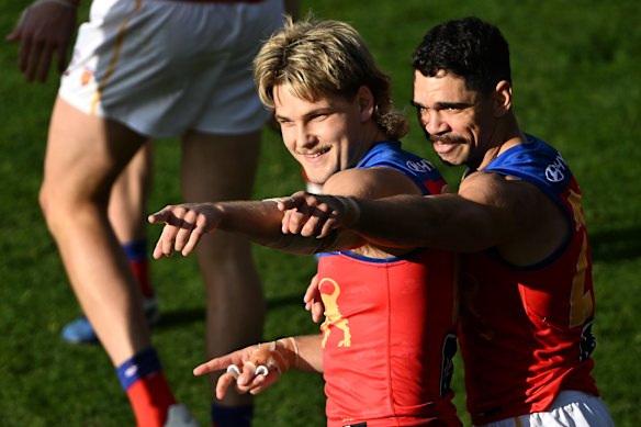 Will Ashcroft kicked a miracle goal, and celebrates with Charlie Cameron.