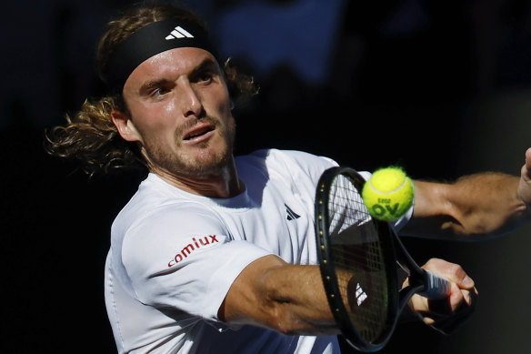 Stefanos Tsitsipas belts a forehand return against Karen Khachanov.