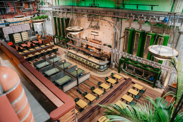 Machinery for moving coffee beans decorates the space.