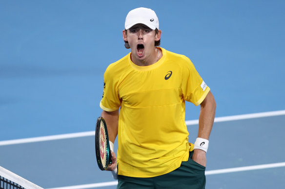 Alex de Minaur celebrates his singles win.