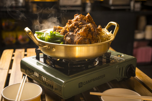 Spicy beef ribs on a gas burner.