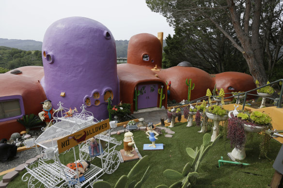 The court ruling allows the colorful, bulbous-shaped house Flintstone House to stay. 
