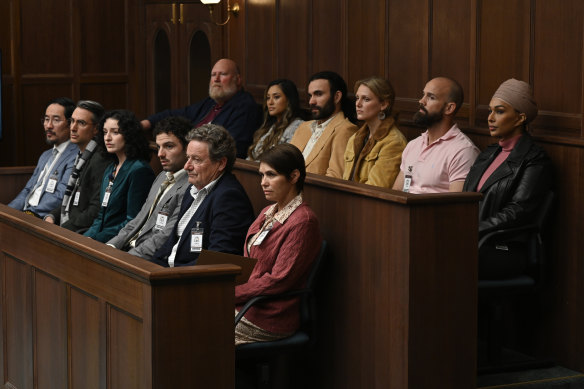 The jury, played by (from back row left to front row right) Brad Francis, Suesha Rana, Nelson Baker, Isabelle Basen, Luke Pegler, Sharon Johal, Anthony B. Wong, Adriano Cappelletti, Stefanie Caccamo, Josh McKenzie, Greg McNeill and Tasma Walton, listens.