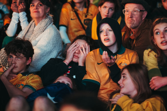 Fans react in Sydney’s Tumbalong Park on Wednesday night. 