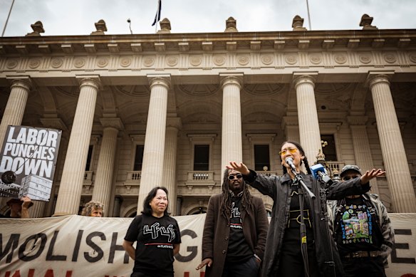 Public housing activist R-Coo speaks on the steps of Parliament house after the final report from the parliamentary inquiry into the demolition was released. 