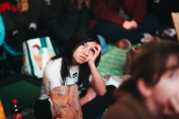 Fans react to the Matildas losing the match, at live site in Tumbalong Park, Darling Harbour.