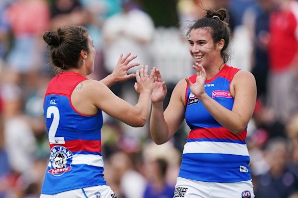 Bonnie Toogood and Ellie Blackburn celebrate a goal.