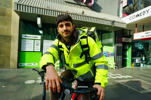 Monash PhD student Andrew Copolov outside the Gig Workers Hub on Bourke Street. 