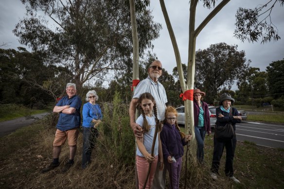 Former VicRoads transport planner John Graves with granddaughters Millicent and Sylvia and members of the Eltham Community Action Group.