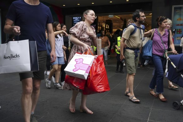 Seasonal gloom: Shoppers on Melbourne’s Bourke Street Mall.