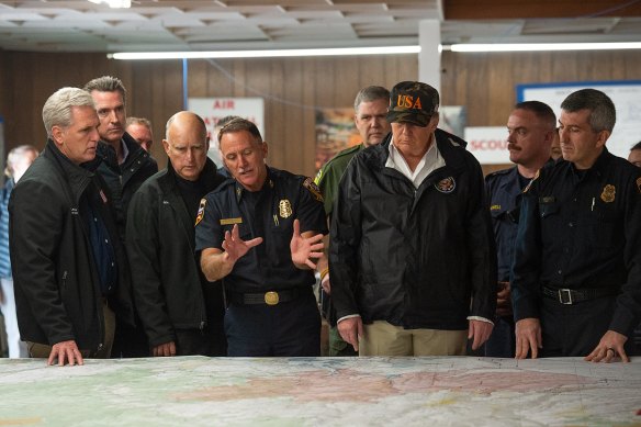 Then Cal Fire Chief Ken Pimlott briefs US politicians, including President Donald Trump, during the California wildfire of 2018.