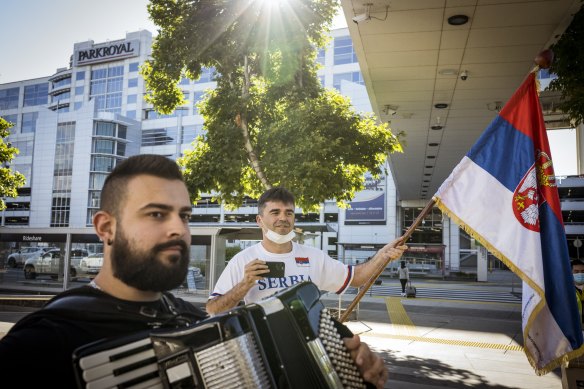 Novak Djokovic fans Krstomir Dusanovic and Slobodan Bendjo at Melbourne Airport in support of the Serbian tennis star. 