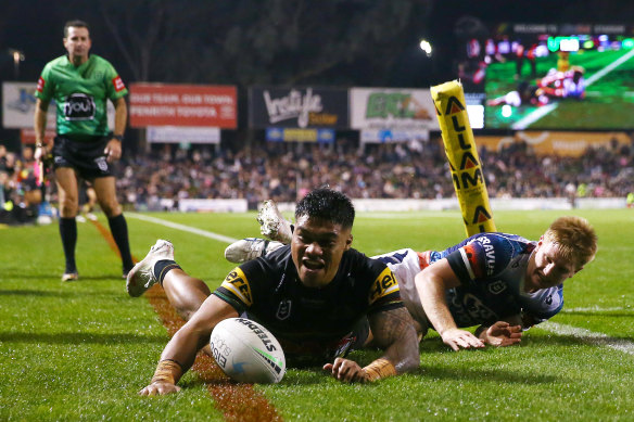 Penrith flyer Brian To’o dives over for a try in the first half at BlueBet Stadium on Friday night.