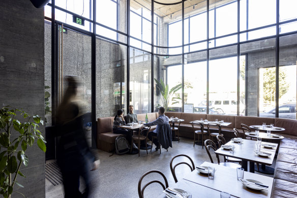 Pizzeria Da Bruno’s “unusually stylish” main dining room has a double-height ceiling.