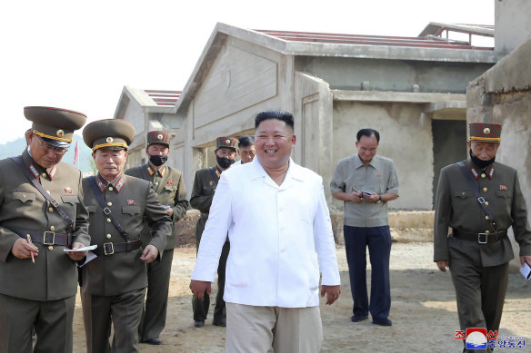 An undated photo provided on Thursday, July 23, 2020 by the North Korean government, in which leader Kim Jong-un visits a new chicken farm.