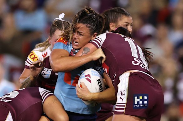 NSW prop Millie Elliott takes a hit-up against Queensland in Origin I.