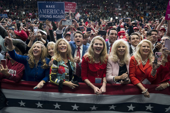 Members of the Word of Faith Fellowship cheer for Trump at a campaign rally in Charlotte, North Carolina, in 2018.